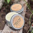 sun balm tin in the garden